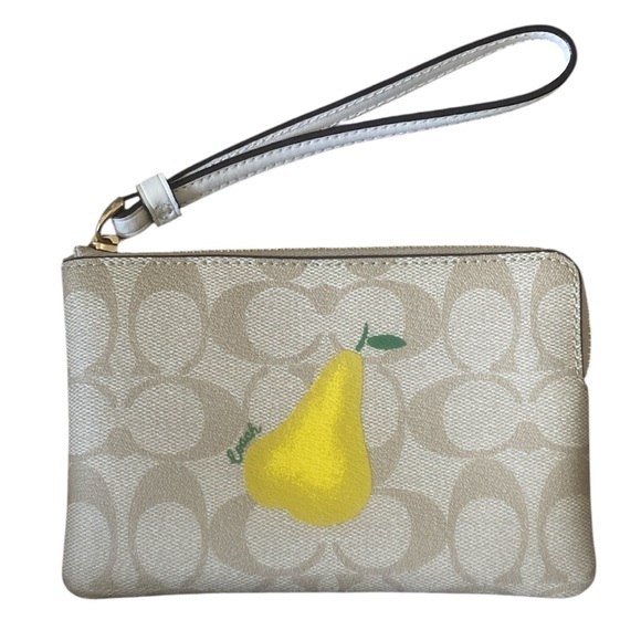 Coach Handbags - Coach NWOT Corner Zip Wristlet In Signature Canvas With Pear